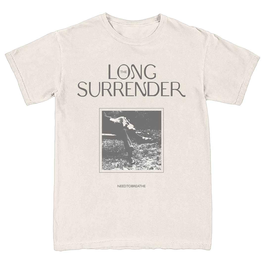 Beige t-shirt with 'The Long Surrender' graphic design on a white background